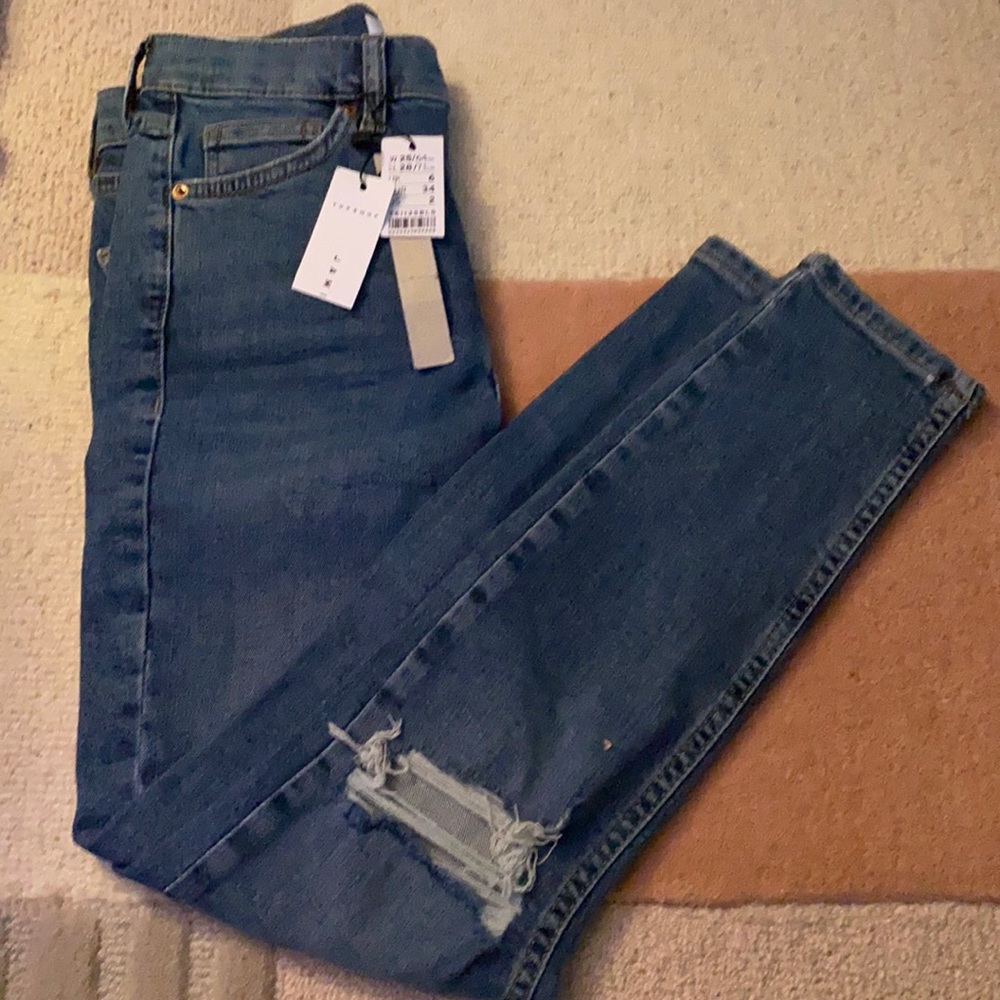Ripped blue skinny jeans. Top shop Jaime. NWT.